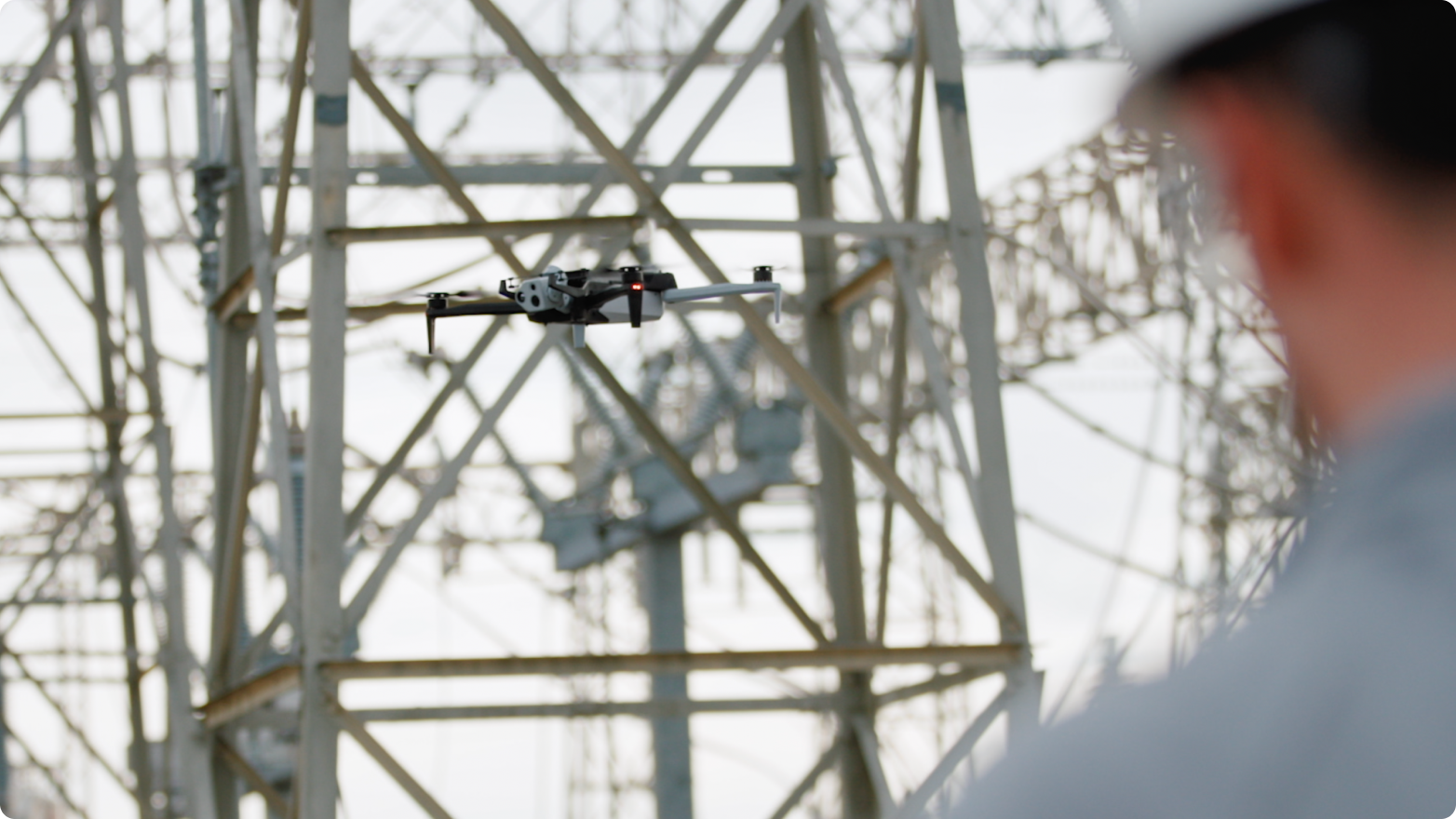 Skydio X10 drone flying near utility power infrastructure